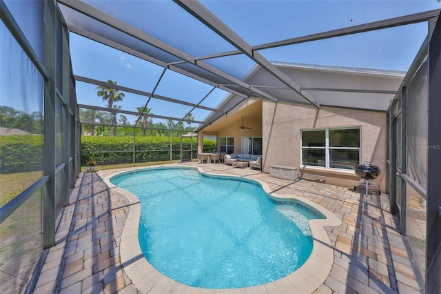 14502 Pond Cypress Way, Tampa, FL 33626 - outdoor pool with a patio, a ceiling fan, outdoor lounge area, and glass enclosure