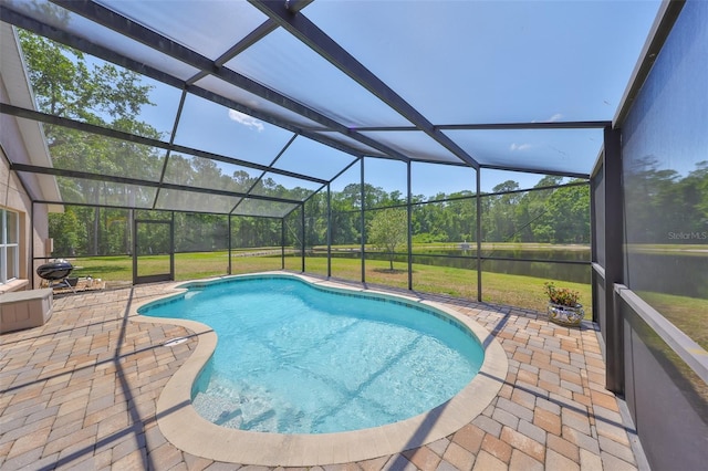 14502 Pond Cypress Way, Tampa, FL 33626 - swimming pool with a patio area, a yard, a water view, and glass enclosure
