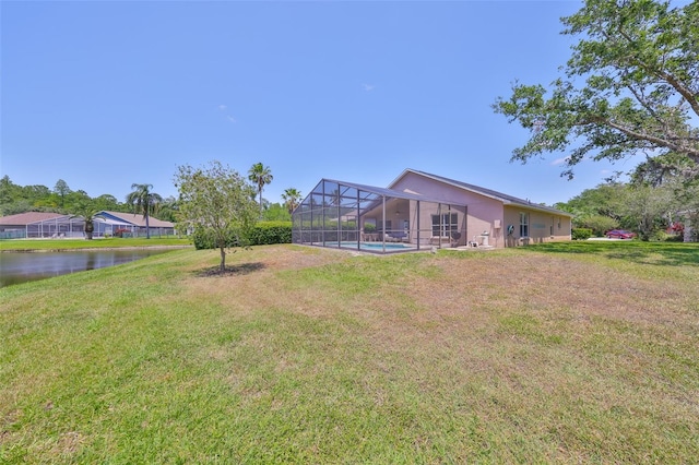 14502 Pond Cypress Way, Tampa, FL 33626 - view of grassy yard featuring glass enclosure, an outdoor pool, and a water view