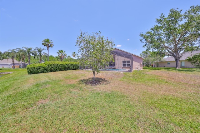 14502 Pond Cypress Way, Tampa, FL 33626 - view of green lawn with a lanai