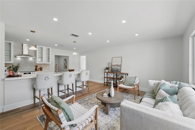 2815 Golfview Dr, Melbourne, FL 32901 - living area with light wood-style flooring, baseboards, and recessed lighting