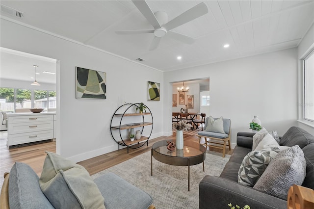 2815 Golfview Dr, Melbourne, FL 32901 - living area with light wood-style flooring, a chandelier, a ceiling fan, baseboards, and recessed lighting