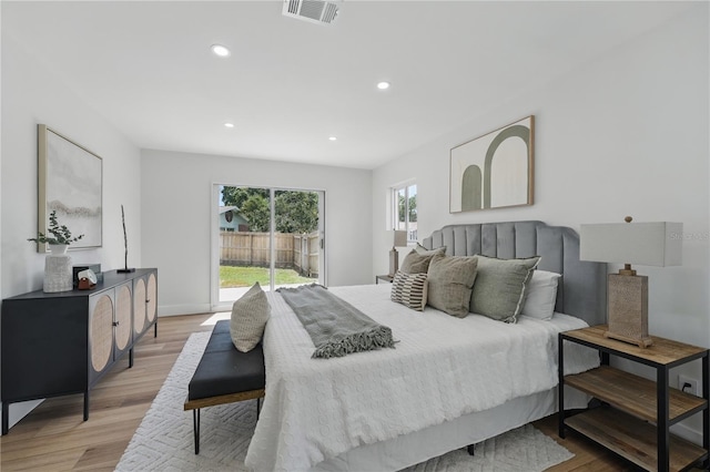 2815 Golfview Dr, Melbourne, FL 32901 - bedroom with access to exterior, light wood finished floors, recessed lighting, and baseboards