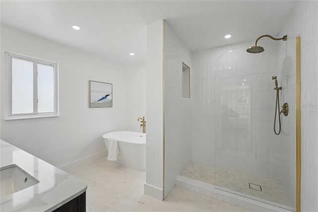 2815 Golfview Dr, Melbourne, FL 32901 - bathroom with tiled shower, a soaking tub, recessed lighting, vanity, and baseboards