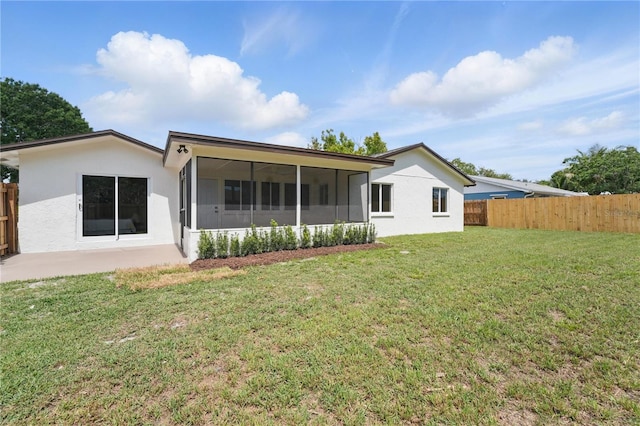 2815 Golfview Dr, Melbourne, FL 32901 - back of property featuring a sunroom and stucco siding