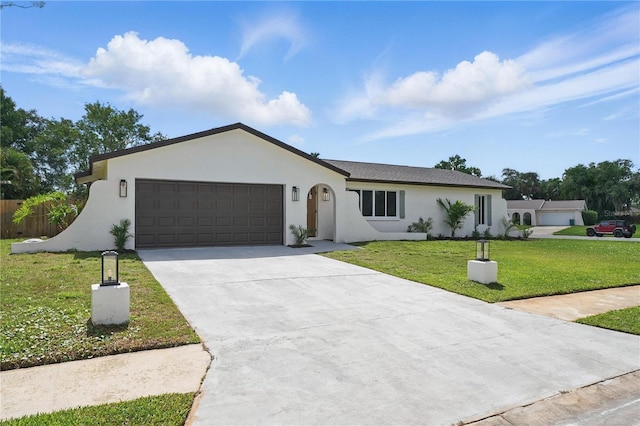 2815 Golfview Dr, Melbourne, FL 32901 - ranch-style house featuring stucco siding, a garage, a front lawn, and driveway