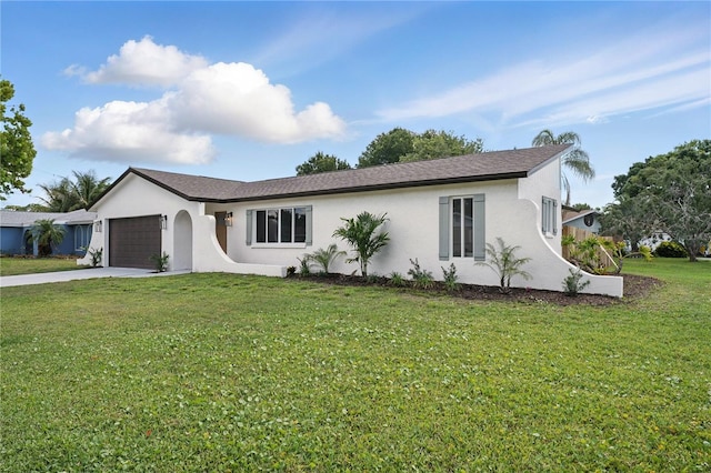 2815 Golfview Dr, Melbourne, FL 32901 - ranch-style house with stucco siding, an attached garage, driveway, and a front yard