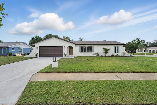 2815 Golfview Dr, Melbourne, FL 32901 - ranch-style house featuring driveway, stucco siding, a garage, and a front yard