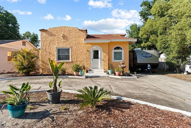 mediterranean / spanish house with stucco siding