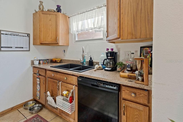 kitchen with dishwasher, a sink, tile patterned floors, and light countertops
