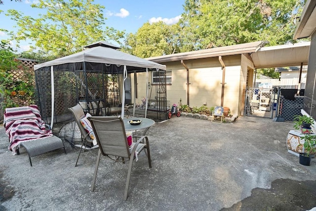 view of patio featuring a gazebo and fence