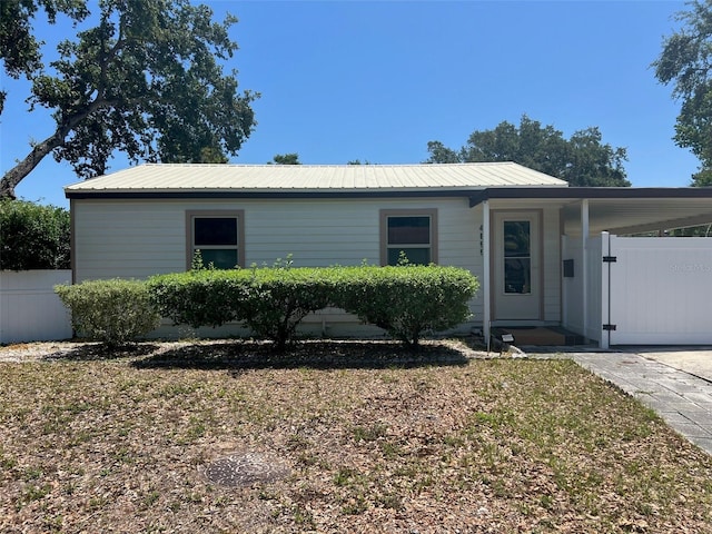 4899 7th St N, Saint Petersburg, FL 33703 - ranch-style home with fence and metal roof
