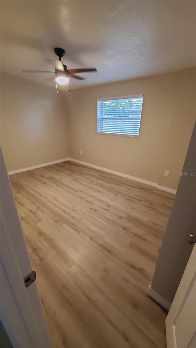 312 Dorothy Ave, Daytona Beach, FL 32117 - empty room with light wood-type flooring, baseboards, and ceiling fan