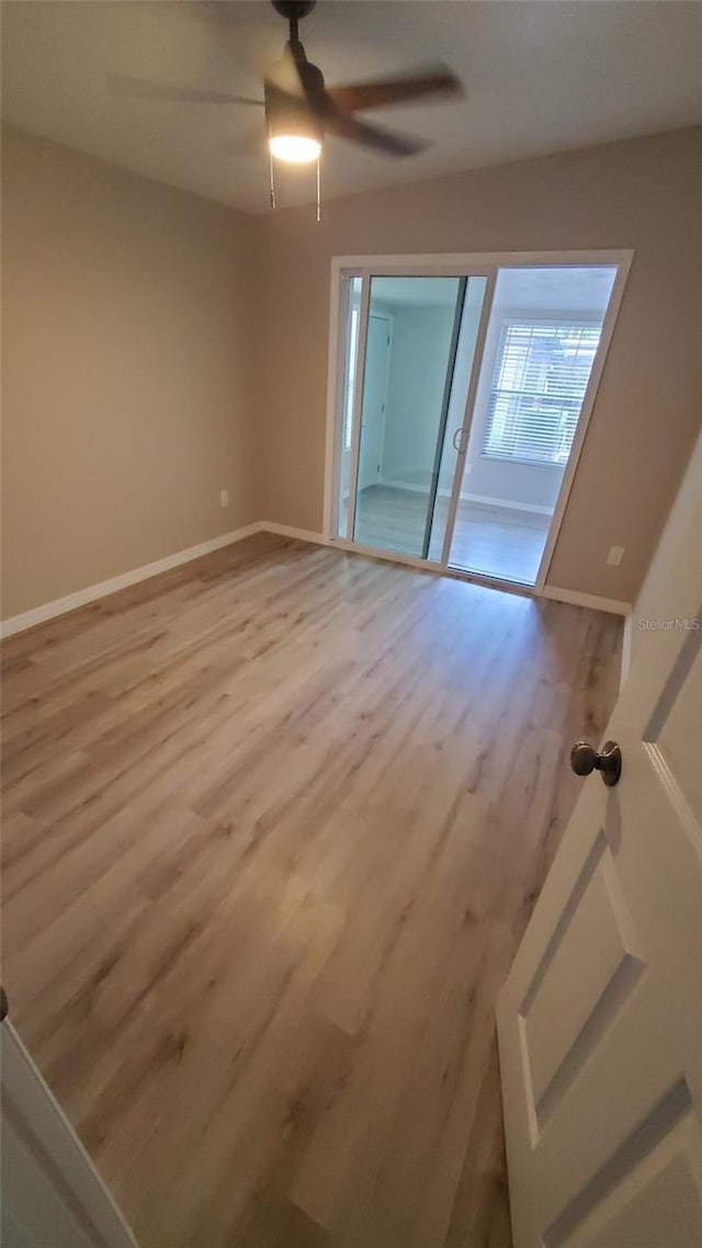 312 Dorothy Ave, Daytona Beach, FL 32117 - empty room with wood finished floors, baseboards, and a ceiling fan