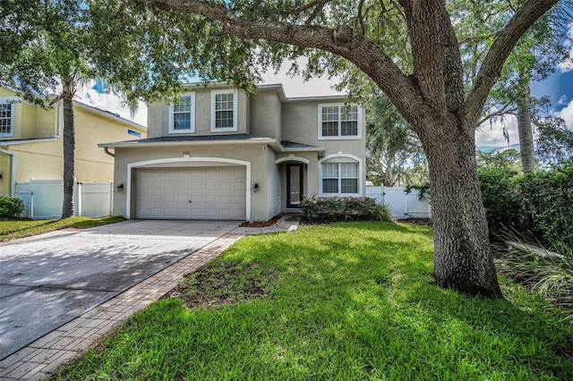 3002 Savannah Oaks Cir, Tarpon Springs, FL 34688 - view of front of home with stucco siding, a garage, concrete driveway, and a gate
