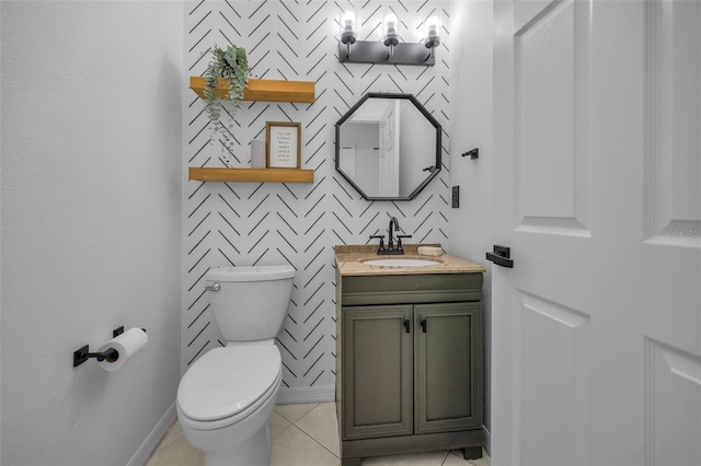 3002 Savannah Oaks Cir, Tarpon Springs, FL 34688 - bathroom featuring toilet, vanity, tile patterned floors, and baseboards