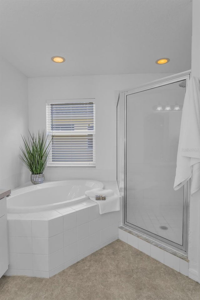 3002 Savannah Oaks Cir, Tarpon Springs, FL 34688 - full bathroom with a shower stall, a bath, and recessed lighting