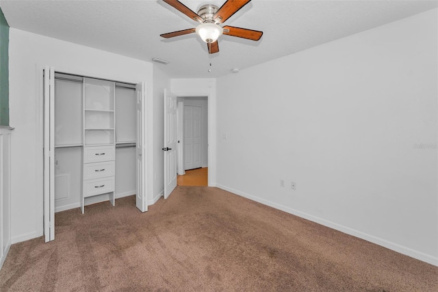 3002 Savannah Oaks Cir, Tarpon Springs, FL 34688 - unfurnished bedroom with carpet, a closet, baseboards, and a ceiling fan