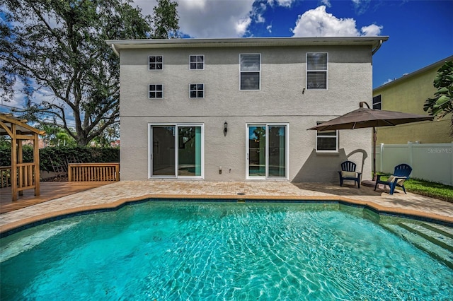 3002 Savannah Oaks Cir, Tarpon Springs, FL 34688 - view of swimming pool featuring a fenced backyard, a deck, and a patio area