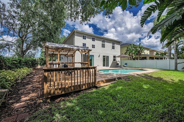 3002 Savannah Oaks Cir, Tarpon Springs, FL 34688 - back of property featuring a deck, stucco siding, and a pergola