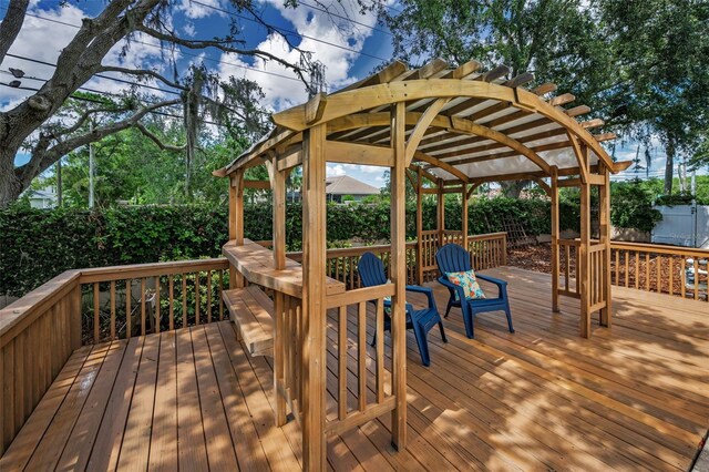 3002 Savannah Oaks Cir, Tarpon Springs, FL 34688 - wooden terrace featuring a fenced backyard and a pergola