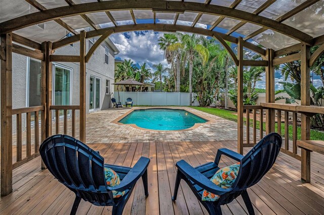 3002 Savannah Oaks Cir, Tarpon Springs, FL 34688 - view of swimming pool with a wooden deck and a fenced backyard