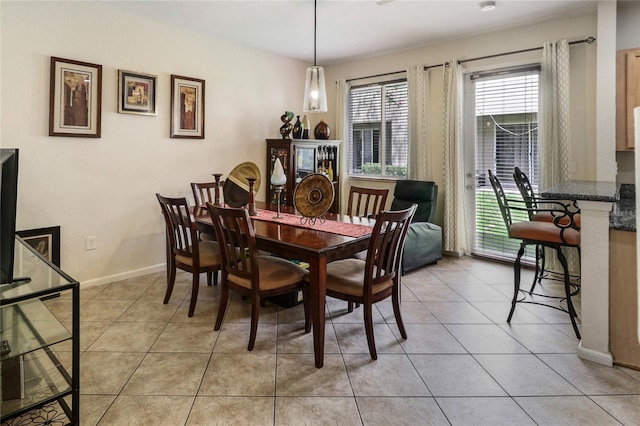 21115 NW 14th Pl Unit 2, Miami, FL 33169 - dining room featuring light tile patterned floors and baseboards