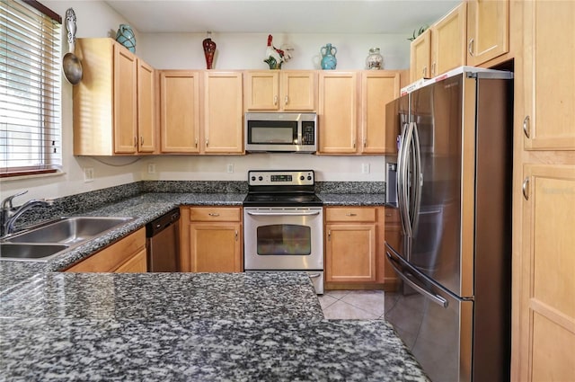 21115 NW 14th Pl Unit 2, Miami, FL 33169 - kitchen with appliances with stainless steel finishes, a sink, light brown cabinets, and light tile patterned floors