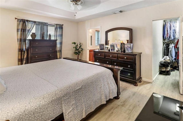 21115 NW 14th Pl Unit 2, Miami, FL 33169 - bedroom featuring light wood finished floors, baseboards, a ceiling fan, and a closet