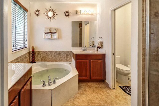 21115 NW 14th Pl Unit 2, Miami, FL 33169 - full bath with two vanities, tile patterned floors, toilet, a garden tub, and a stall shower