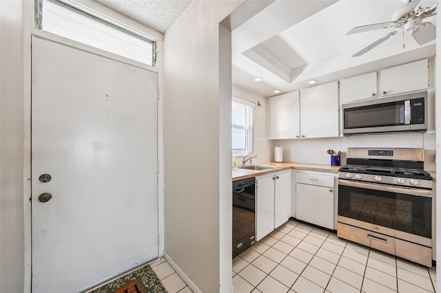 6020 S Shore Blvd Unit 709, Gulfport, FL 33707 - kitchen with stainless steel appliances, light countertops, white cabinets, a ceiling fan, and recessed lighting