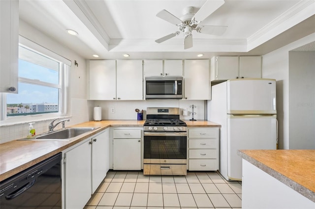 6020 S Shore Blvd Unit 709, Gulfport, FL 33707 - kitchen featuring stainless steel appliances, decorative backsplash, light countertops, white cabinets, and a ceiling fan