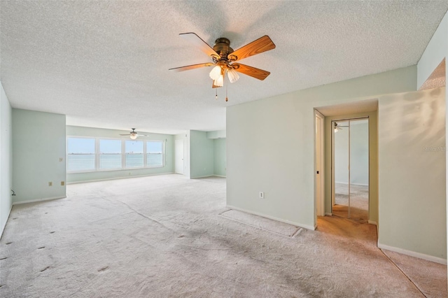 6020 S Shore Blvd Unit 709, Gulfport, FL 33707 - carpeted spare room with ceiling fan and a textured ceiling