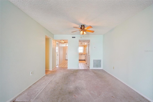 6020 S Shore Blvd Unit 709, Gulfport, FL 33707 - carpeted empty room with a ceiling fan and a textured ceiling
