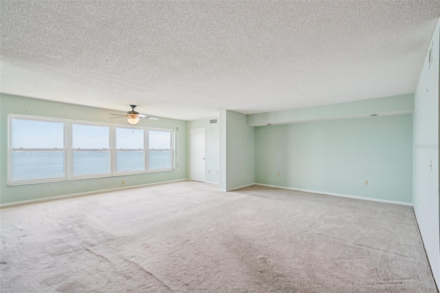6020 S Shore Blvd Unit 709, Gulfport, FL 33707 - empty room featuring carpet flooring, ceiling fan, and a textured ceiling