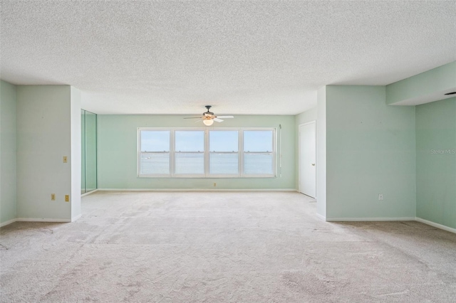 6020 S Shore Blvd Unit 709, Gulfport, FL 33707 - carpeted spare room with ceiling fan and a textured ceiling
