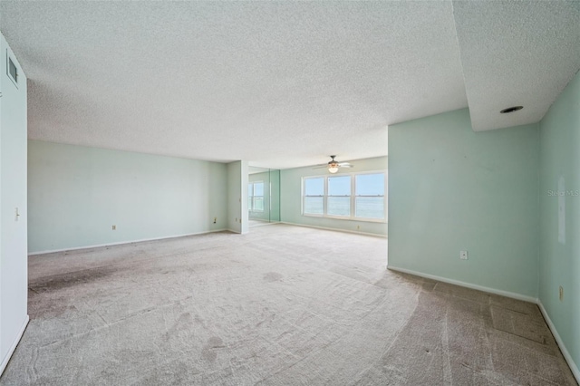 6020 S Shore Blvd Unit 709, Gulfport, FL 33707 - carpeted empty room featuring a textured ceiling and a ceiling fan