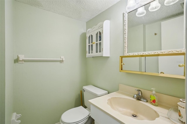 6020 S Shore Blvd Unit 709, Gulfport, FL 33707 - bathroom with a textured ceiling and vanity