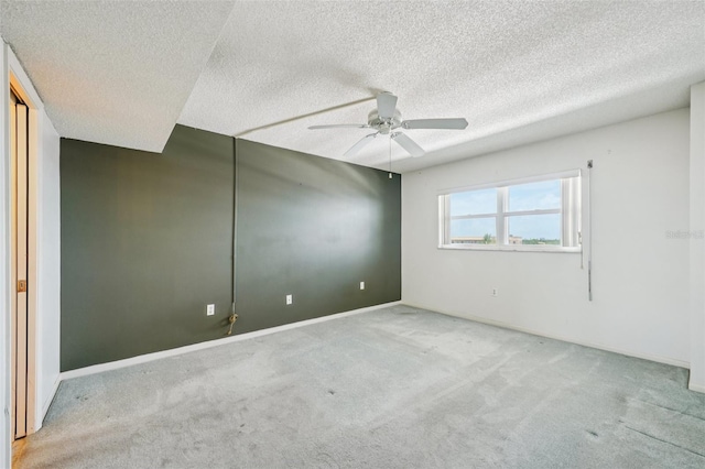 6020 S Shore Blvd Unit 709, Gulfport, FL 33707 - unfurnished room featuring carpet, ceiling fan, and a textured ceiling