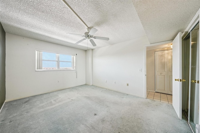 6020 S Shore Blvd Unit 709, Gulfport, FL 33707 - unfurnished bedroom with carpet flooring, a ceiling fan, and a textured ceiling