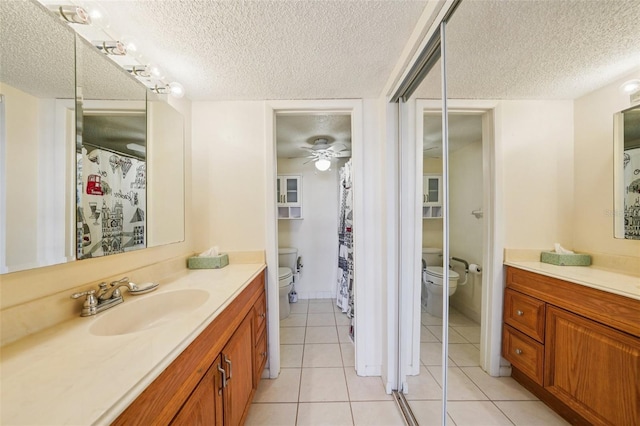 6020 S Shore Blvd Unit 709, Gulfport, FL 33707 - full bathroom with a textured ceiling, vanity, tile patterned floors, and ceiling fan