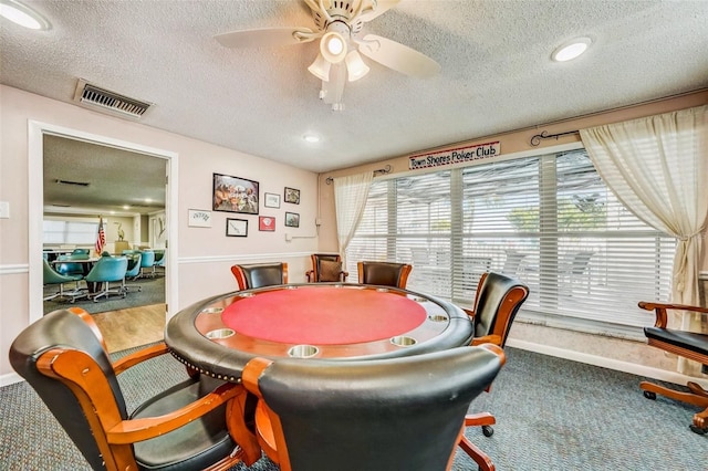 6020 S Shore Blvd Unit 709, Gulfport, FL 33707 - rec room with carpet flooring, a textured ceiling, and ceiling fan