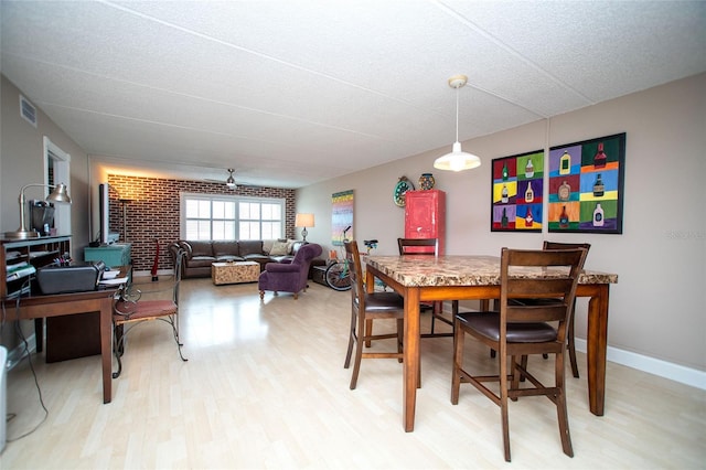 12300 Park Blvd Unit 222, Seminole, FL 33772 - dining area with light wood finished floors and baseboards