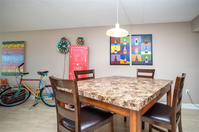 12300 Park Blvd Unit 222, Seminole, FL 33772 - dining space featuring light wood-type flooring