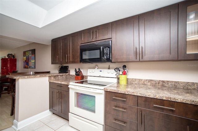 12300 Park Blvd Unit 222, Seminole, FL 33772 - kitchen with black microwave, white range with electric stovetop, dark brown cabinets, glass insert cabinets, and light tile patterned flooring