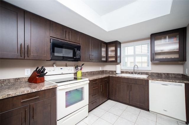 12300 Park Blvd Unit 222, Seminole, FL 33772 - kitchen featuring white appliances, a sink, dark brown cabinets, and light tile patterned floors
