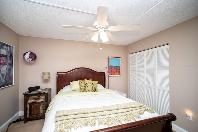 12300 Park Blvd Unit 222, Seminole, FL 33772 - bedroom featuring a closet, light colored carpet, baseboards, and ceiling fan
