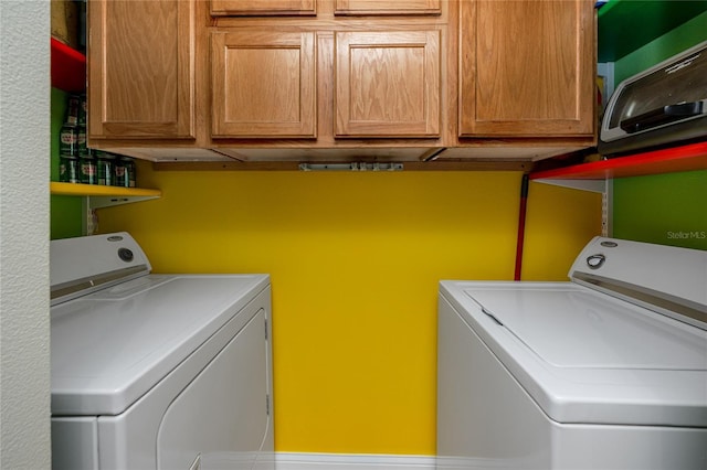 10764 70th Ave Unit 5302, Seminole, FL 33772 - laundry area featuring separate washer and dryer and cabinet space