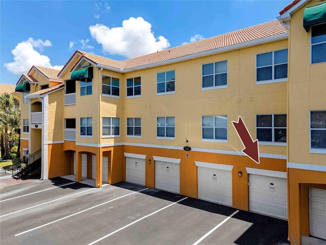 10764 70th Ave Unit 5302, Seminole, FL 33772 - view of property with a garage and driveway