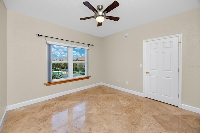 10764 70th Ave Unit 5302, Seminole, FL 33772 - empty room featuring ceiling fan and baseboards